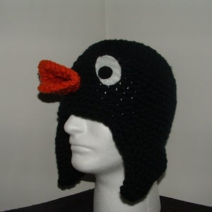 Gorro de pingüino de tamaño adulto, hecho a mano, de crochet, con orejeras y ojos grandes como Pingu.