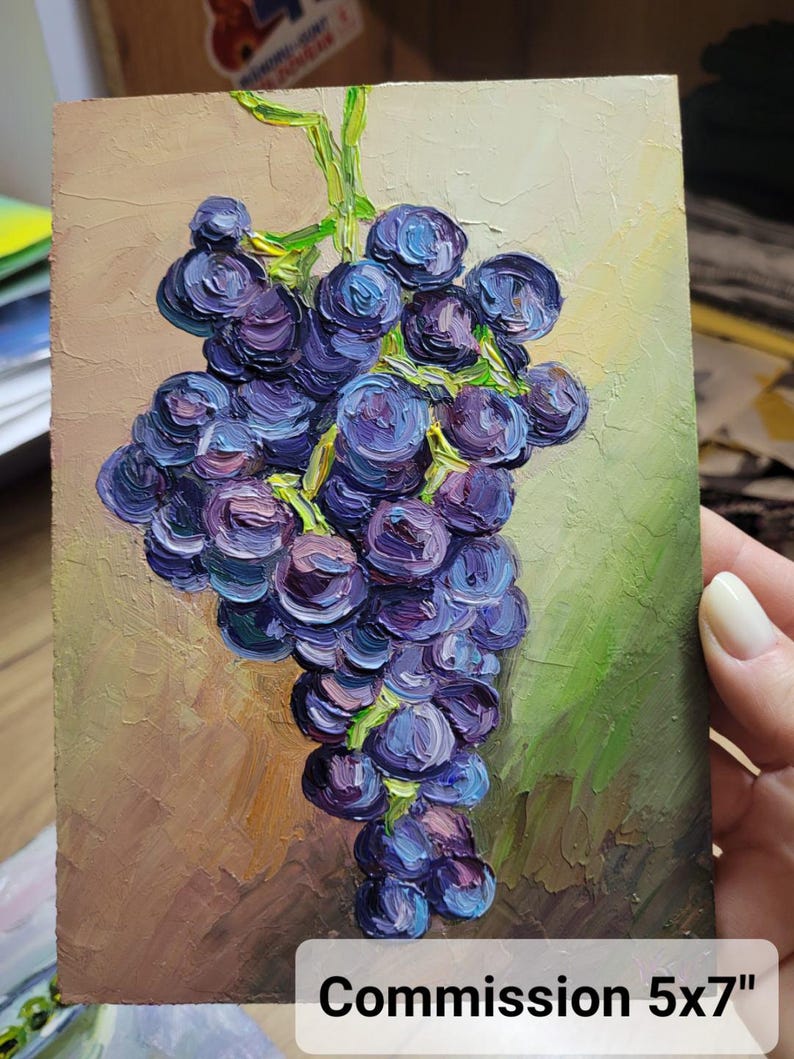 Oil painting of a bunch of grapes in shades of purple and blue, with green stems and leaves. The artwork is on a 5x7 inch panel, with a textured brushstroke style. The background has a mix of brown and green tones.