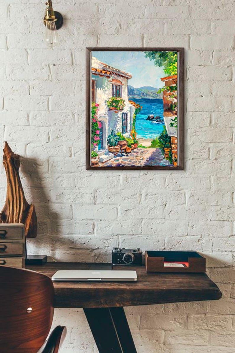 May include: A framed oil painting depicting a coastal Mediterranean scene with a white stucco building, vibrant potted flowers, a stone pathway, and a bright blue sea under a clear sky, rendered with visible brushstrokes and rich textures.