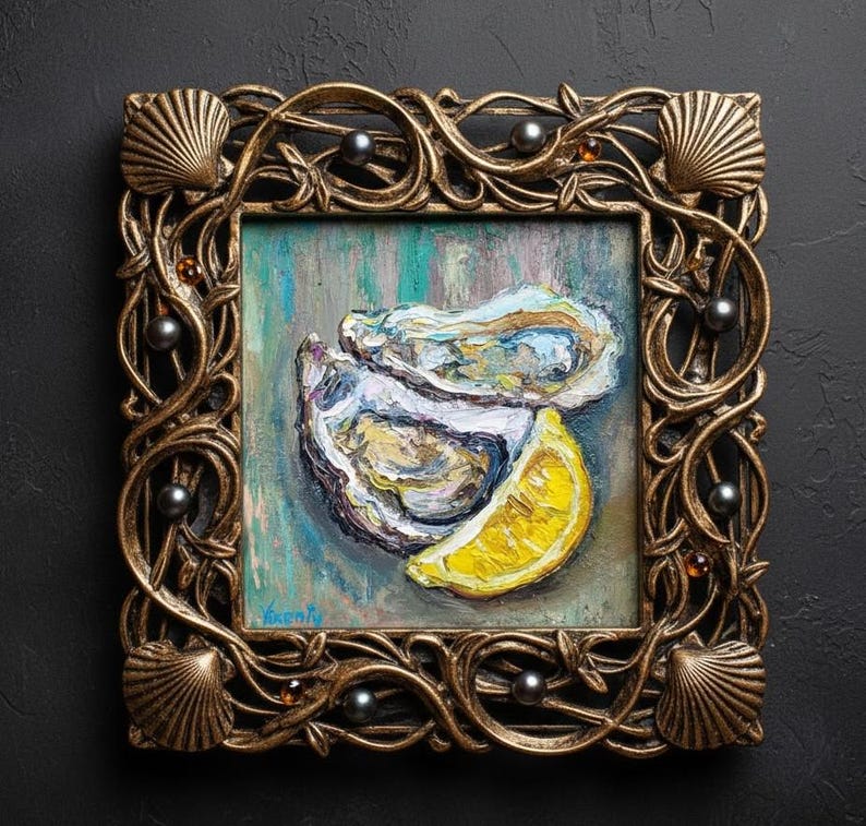 May include: Square framed oil painting of oysters and a lemon wedge. The painting is in a gold ornate frame with seashell and pearl accents. The painting has a teal, blue, and yellow color palette.