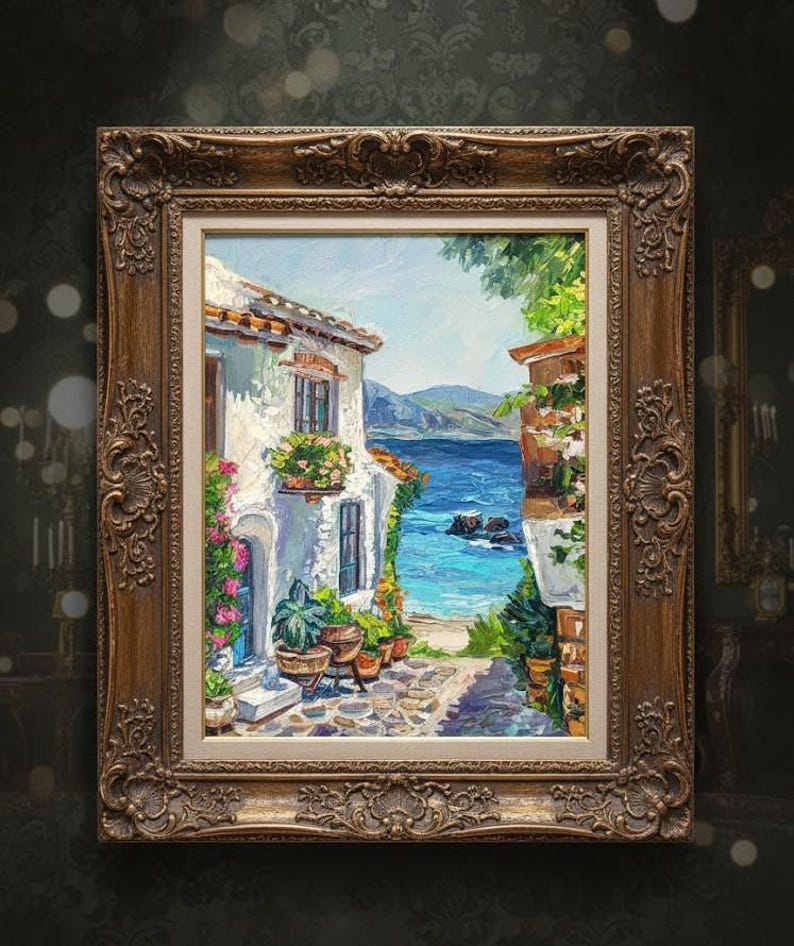 May include: An oil painting in a decorative bronze-colored frame depicting a coastal scene with a white building, potted plants, and flowers along a stone path leading to a bright blue sea with distant mountains under a clear sky.