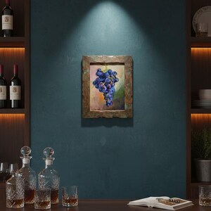May include: A rectangular framed painting featuring a cluster of dark purple grapes against a soft, blended background of muted green, yellow, and orange tones. The frame has a textured, weathered metallic finish with copper and bronze hues.
