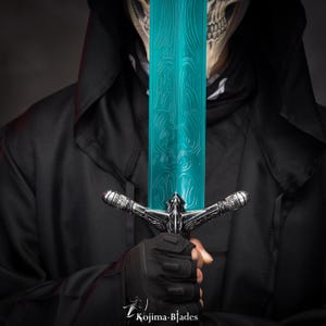 May include: A person wearing a black hooded cloak holds a teal-colored sword with silver accents. The sword has a detailed design on the blade.