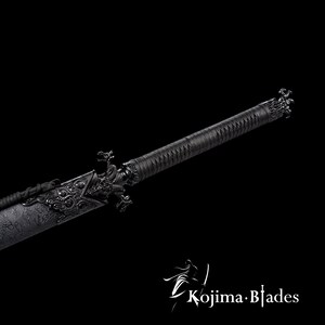 May include: A black katana sword with a dragon design on the hilt and scabbard. The sword has a black leather wrap and a black metal scabbard.