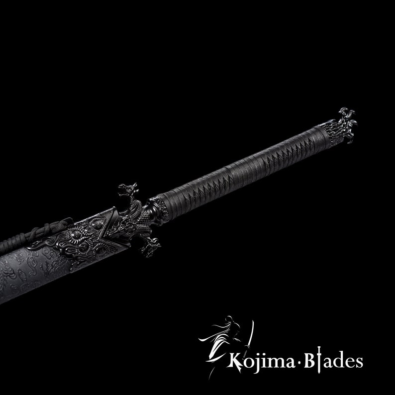 May include: A black katana sword with a dragon design on the hilt and scabbard. The sword has a black leather wrap and a black metal scabbard.