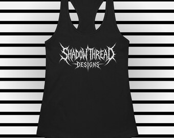 May include: A black racerback tank top featuring a white graphic print on the chest. The graphic displays the text SHADOW THREAD DESIGNS in a stylized, sharp, and jagged font that resembles metal band typography with pointed, thorn-like edges.
