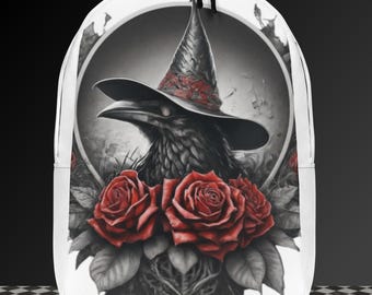 May include: A white backpack with a black raven wearing a witch's hat and surrounded by red roses. The raven has a dark gray and black feathered body and a long, pointed beak. The roses are in full bloom and have a dark red color.