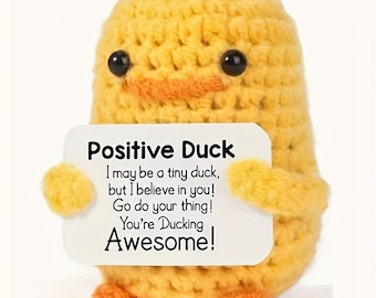 May include: A yellow crocheted duck holding a white card with the text "Positive Duck I may be a tiny duck, but I believe in you! Go do your thing! You're Ducking Awesome!"