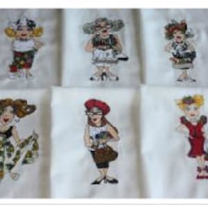 May include: Six embroidered designs featuring cartoon women wearing different outfits and accessories. The designs are on white fabric and are ready to be sewn onto a project.