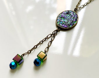 Purple and green glitter necklace with bronze chain and green cube dangles