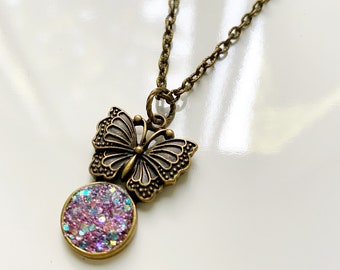 Pink glitter butterfly necklace with bronze chain