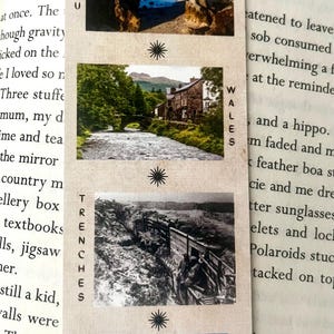 May include: A book with the title "Our Infinite Fates" and several small images of different landscapes. The images are labeled with the locations: "Nauru", "Wales", "Trenches", and "Siberia".