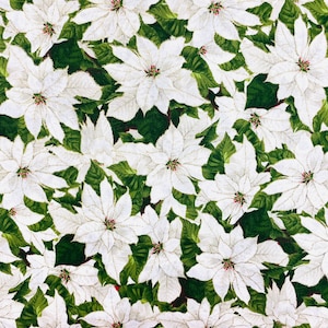 May include: A fabric featuring a dense pattern of white poinsettia flowers with green leaves and gold glitter accents. A wooden Westcott ruler is positioned at the bottom, showing a scale from 0 to 15 inches for size reference.