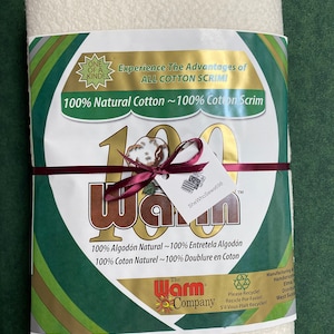 May include: A white 100% cotton scrim fabric package with a green and gold label. The label reads "Experience the Advantages of All Cotton Scrim" and "100% Natural Cotton ~ 100% Cotton Scrim". The label also includes the text "The Warm Company" and a recycling symbol with the text "Please Recycle!"