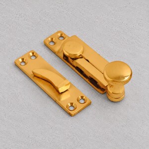 真鍮製四分円窓用ファスナー