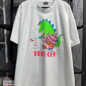 Vintage jaren 90 afgeslagen golfen dinosaurus 1991 T-shirt maat XL Vintage grappige dinosaurus golf humor cartoon parodie T-shirt