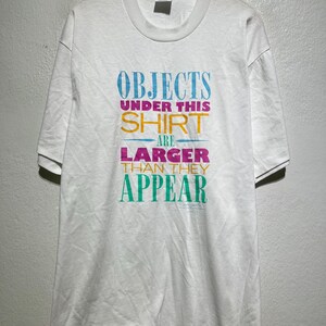 Vintage 90s Objects Under This Shirt Are Larger Funny Humor Colorful Typography T-Shirt Size L