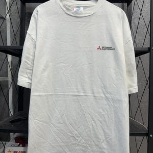 Camiseta vintage de Mitsubishi Electronics de los años 90, Fruit of the Loom, fabricada en EE. UU., con el logotipo corporativo, talla XL