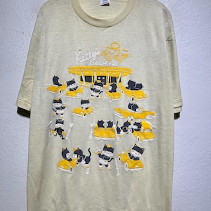 Vintage jaren 80 Kitty's drive-in cartoon katten T-shirt diner autoscène grafisch maat L