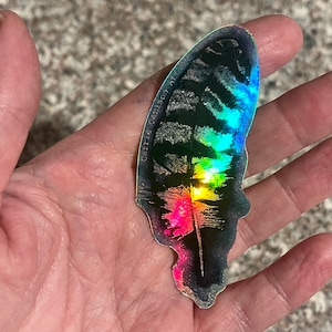 Pegatina de vinilo holográfica con dibujo de plumas