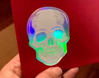 Human Skull Vinyl Sticker from original linoleum block print (white on holographic)