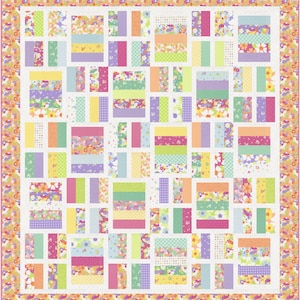 May include: A colorful patchwork quilt with a floral border. The quilt features rectangular blocks in pastel shades of pink, green, yellow, and purple, with floral and patterned fabrics. The border is a repeating floral design.