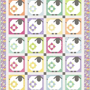 May include: A colorful patchwork quilt featuring a repeating pattern of sheep. Each sheep is set within a square of a different pastel color, with a floral design in the center. The quilt is bordered with a floral pattern.