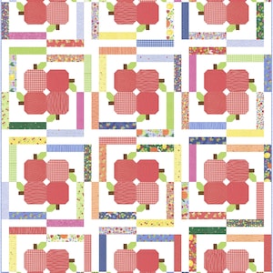 May include: A patchwork quilt with a repeating pattern of red apple clusters. Each apple is made up of four sections with different textures. The quilt incorporates various patterned fabrics in the borders, including floral, gingham, and striped designs.