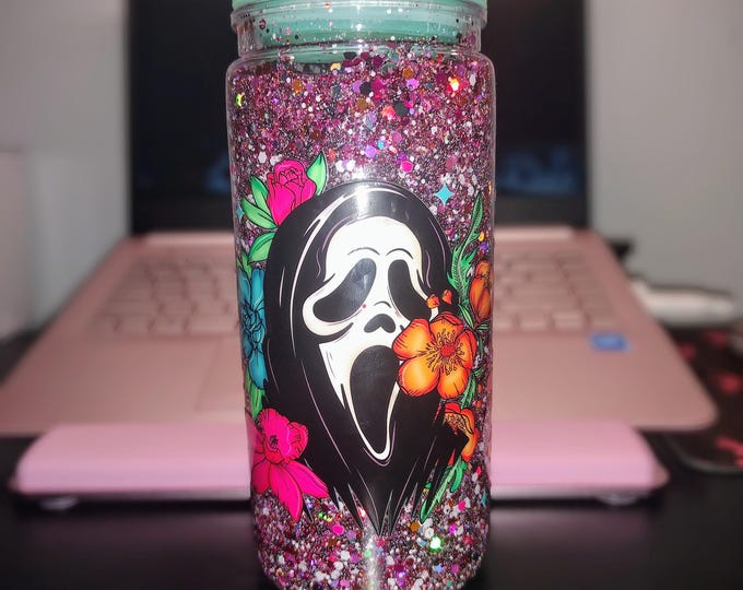 Featured listing image: 20oz Plastic Snow Globe Tumbler – Glitter Spooky Mask with Tropical Flowers – Double-Walled Iced Drink Cup – Handmade