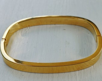 Vintage signed Napier hinged bangle Bracelet, gold tone. layering Bangle