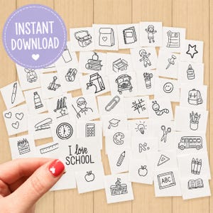 May include: A collection of small white square cards featuring black line art illustrations of school-related items such as a bus, books, a clock, a calculator, and a card with the text I love SCHOOL, arranged in a scattered pattern.