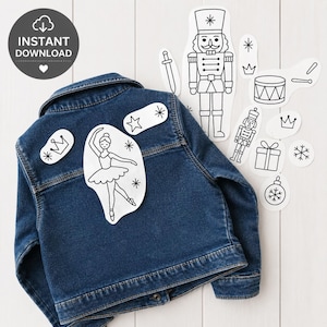 May include: A dark blue denim jacket with white patches featuring a ballerina, stars, and crowns. Additional white outline illustrations of a nutcracker, drum, sword, and ornaments are scattered around the jacket. The image includes the text "INSTANT DOWNLOAD".