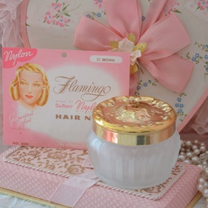 NEW OLD STOCK 1947 hair net in pink package & large ornate glass powder container, stunning duo!