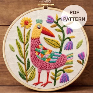 May include: Embroidered hoop art featuring a colorful bird design with a yellow head, pink body, and a red beak. The design includes flowers and foliage in shades of yellow, green, and purple. The text "PDF PATTERN" is visible.