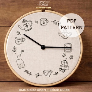 May include: A circular, beige fabric clock in a wooden hoop, adorned with hand-stitched images of teapots, teacups, and tea accessories. The clock hands are black. The text "PDF PATTERN" is visible. The text "DMC Color Chart + Stitch Guide" is also visible.