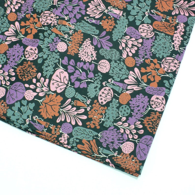 May include: A dark green fabric with a repeating pattern of stylized plants and flowers in shades of pink, purple, brown, and green.
