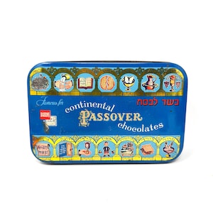 May include: A rectangular blue metal tin for Barons continental Passover chocolates. The lid features gold arches containing illustrations of traditional Passover symbols, Hebrew text, and the words Famous for continental Passover chocolates.