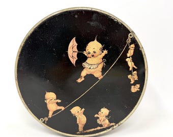 Lata Kewpie vintage, lata redonda antigua, diseño de Rose O'Neill.