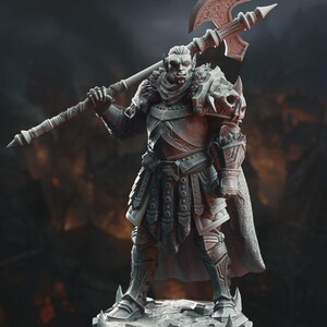 May include: A gray painted miniature figurine of an orc warrior wearing armor and holding a large axe. The orc has a fierce expression and is standing on a rocky base.
