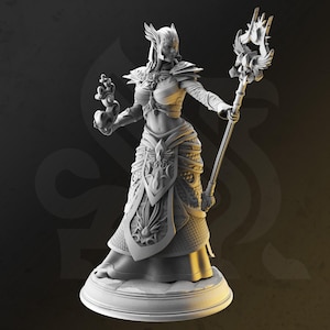 May include: A white, detailed, sculpted figurine of a female figure with wings, wearing a long, ornate gown and holding a staff with a bird on top.