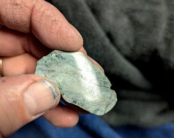 Superior stone with copper inclusions.