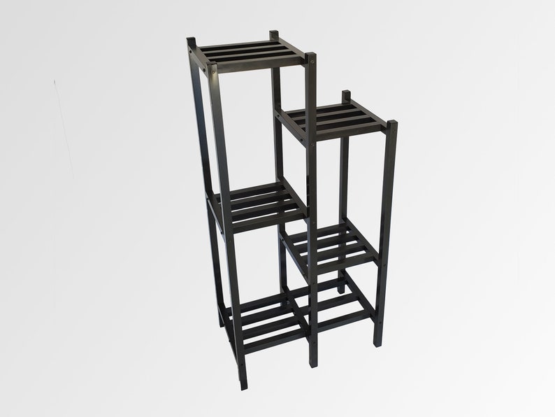 May include: A black, multi-tiered plant stand with a stepped design. The stand has four square platforms of varying heights, each with horizontal slats. The frame is constructed of square metal tubing.