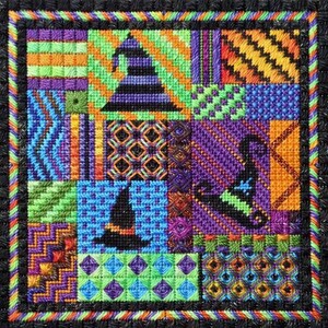 May include: A colourful patchwork quilt with a Halloween theme. The quilt features a variety of patterns and colours, including black, green, purple, orange, and blue. The quilt is decorated with images of witches' hats and cats.