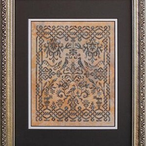 May include: A framed cross-stitch embroidery with a beige background and a dark blue and black design featuring birds and floral motifs.
