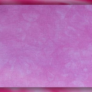 May include: A close-up of a purple fabric with a subtle grid pattern. The fabric has a soft, textured feel.