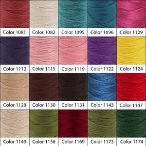 May include: A color chart of 20 different shades of thread, including red, blue, green, yellow, brown, and pink. Each color is labeled with a number.