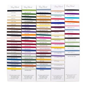 May include: A display of color swatches of Very Velvet ribbon, each labeled with a unique code. The ribbon colors range from black to pearl gray, with shades of green, blue, red, and gold. The text "Very Velvet" is at the top.