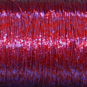 May include: A spool of metallic red and purple thread. The thread is shiny and has a slight iridescent sheen.