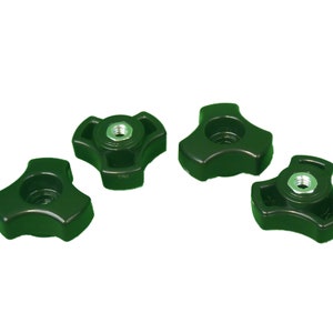 May include: Four black, triangular-shaped knobs with a threaded metal insert in the center. The knobs have a smooth, glossy finish and are evenly spaced against a white background. These are likely used for tightening or adjusting.