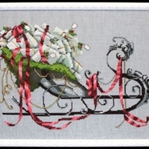 May include: A black metal sleigh filled with wrapped gifts, tied with red ribbon and topped with green moss. The sleigh is decorated with gold accents and red and white plaid ribbon.